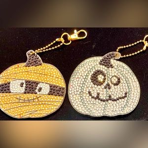 Halloween sparkling key chains or purse accessories. A mummy and a ghost pumpkin